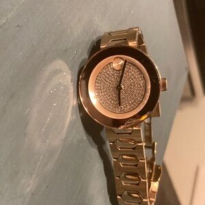 WOMENS. rose gold movado watch with swarovski crystals.